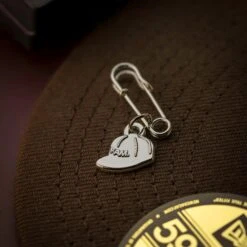 FAM PENDANT CAP PIN -Headwear store 20250708 IMG 8106 Editcopy 1 1 square